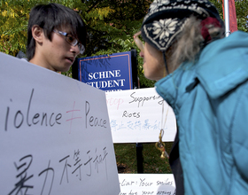 Students protest Dalai Lama's visit outside of SU student center 