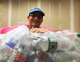 DeWitt resident Laurence Segal quit his job to collect bottles for breast cancer research