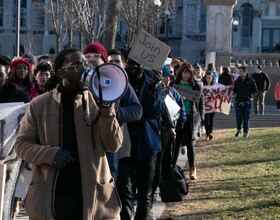 Faculty and students march across campus in support of #NotAgainSU