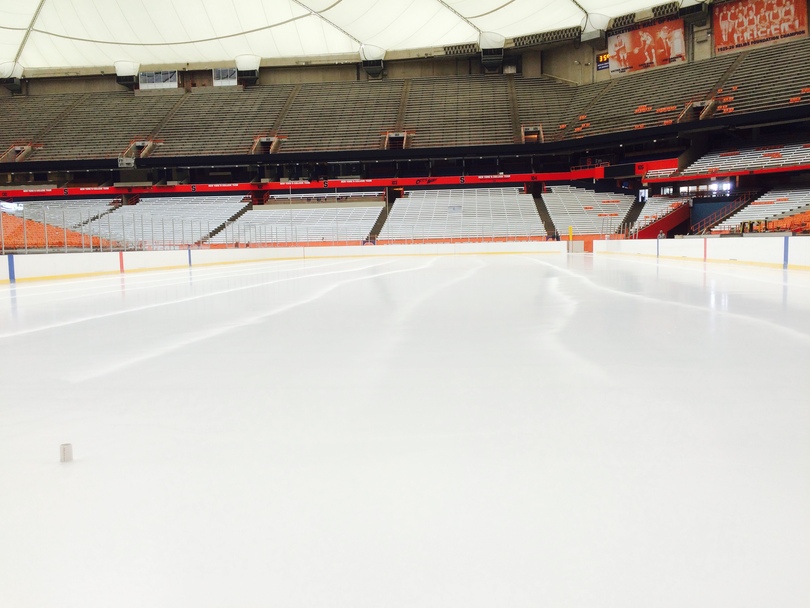 Workers tirelessly construct Carrier Dome rink for Frozen Dome Classic