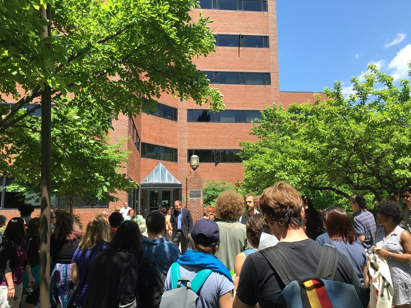 Syracuse University community members protest University Place promenade