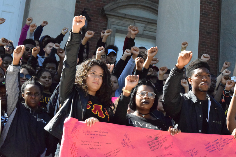 Syracuse University community members march against police violence toward black people