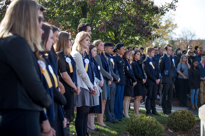 Syracuse University community gathers for emotional Rose Laying Ceremony, concluding Remembrance Week