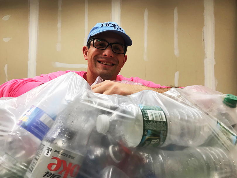 DeWitt resident Laurence Segal quit his job to collect bottles for breast cancer research