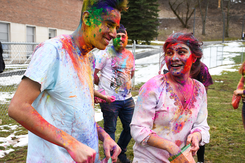 Dozens of students celebrated Holi with color, music