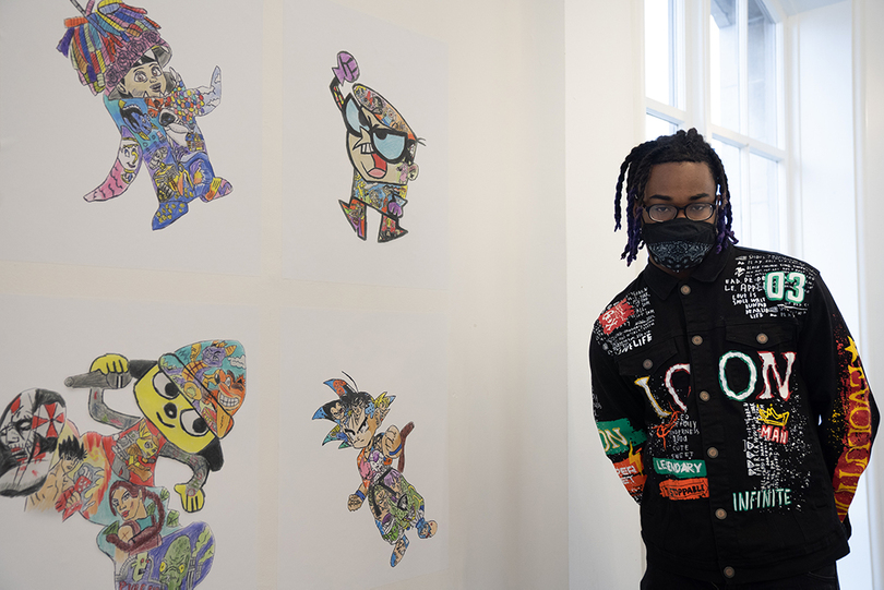 Student displays drawings of superheroes, fictional characters in exhibit